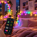Smart RGB fairy lights in a cozy bedroom with app control